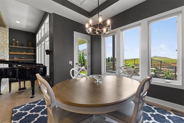 9412 Aurora St, Lenexa, KS 66220 - dining space featuring light wood finished floors, a chandelier, baseboards, and recessed lighting
