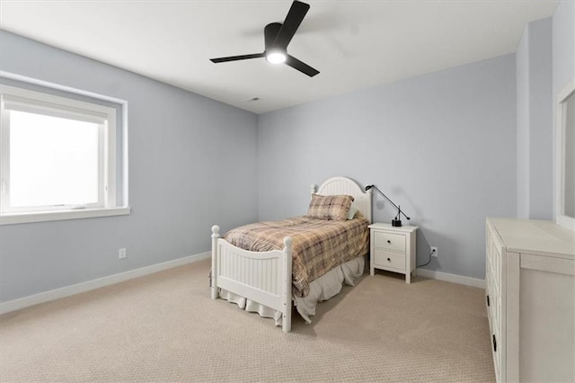 9412 Aurora St, Lenexa, KS 66220 - bedroom with light colored carpet, baseboards, and a ceiling fan