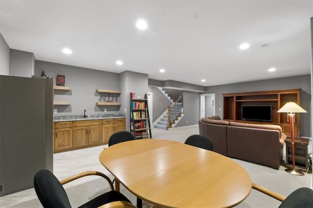 9412 Aurora St, Lenexa, KS 66220 - dining room with bar with sink, stairway, recessed lighting, and light carpet