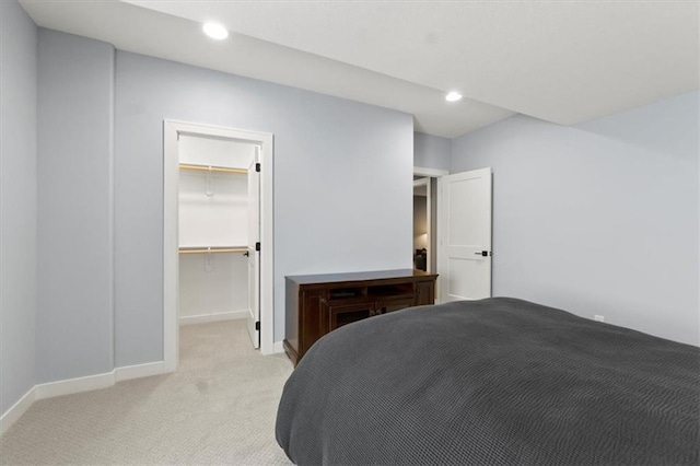 9412 Aurora St, Lenexa, KS 66220 - bedroom featuring light carpet, baseboards, a spacious closet, recessed lighting, and a closet