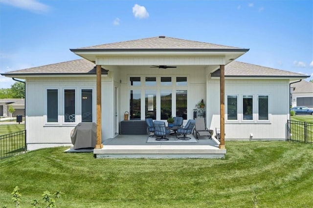 9412 Aurora St, Lenexa, KS 66220 - rear view of house with a ceiling fan and a shingled roof