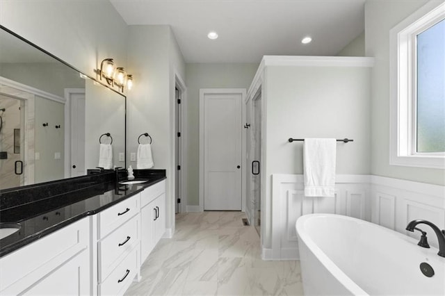 9412 Aurora St, Lenexa, KS 66220 - full bath with a stall shower, double vanity, a freestanding tub, marble look tile flooring, and recessed lighting