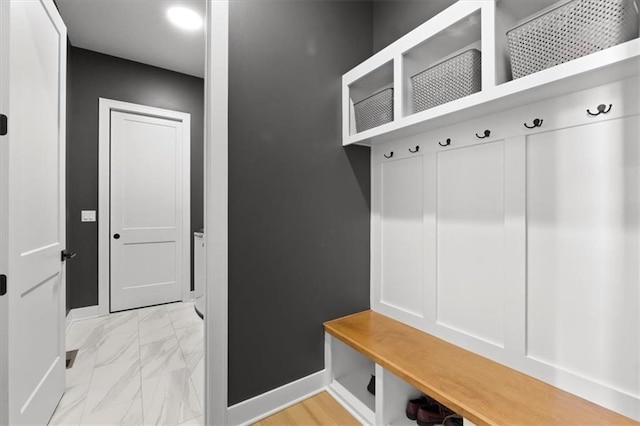9412 Aurora St, Lenexa, KS 66220 - mudroom featuring light marble finish flooring and baseboards