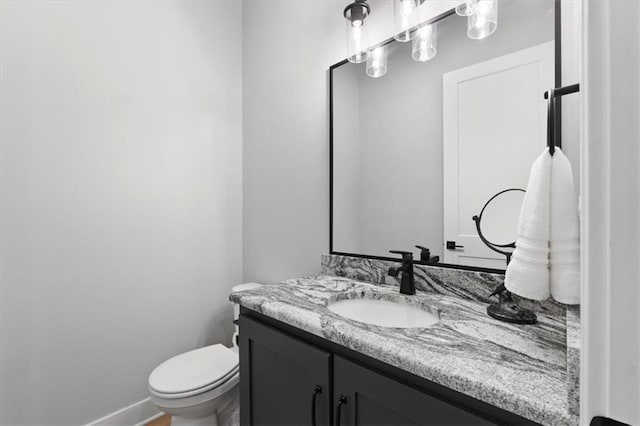 9412 Aurora St, Lenexa, KS 66220 - bathroom featuring vanity, toilet, and baseboards