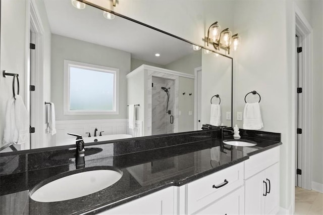 9412 Aurora St, Lenexa, KS 66220 - full bathroom with double vanity, a stall shower, a bathtub, and recessed lighting