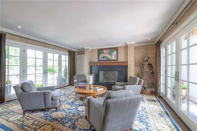 1055 W 54th St, Kansas City, MO 64112 - living area featuring french doors, ornamental molding, a fireplace, and recessed lighting
