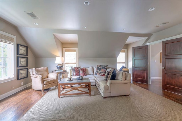 1055 W 54th St, Kansas City, MO 64112 - living room featuring lofted ceiling, wood finished floors, and recessed lighting