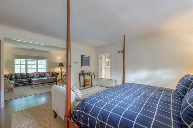 1055 W 54th St, Kansas City, MO 64112 - bedroom featuring crown molding and wood finished floors