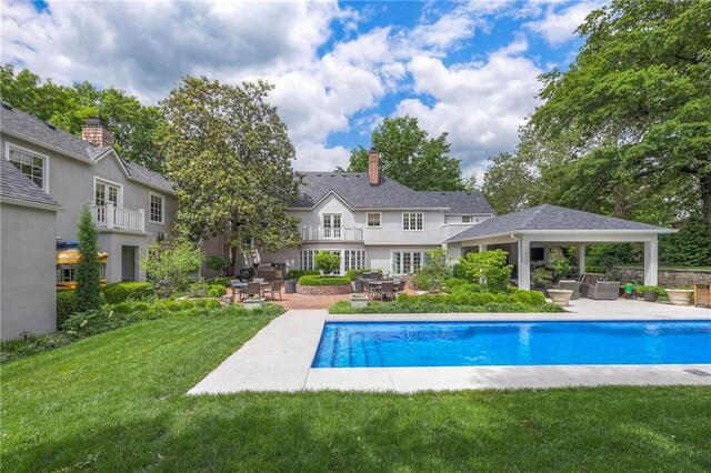 1055 W 54th St, Kansas City, MO 64112 - outdoor pool featuring a gazebo, a lawn, and a patio