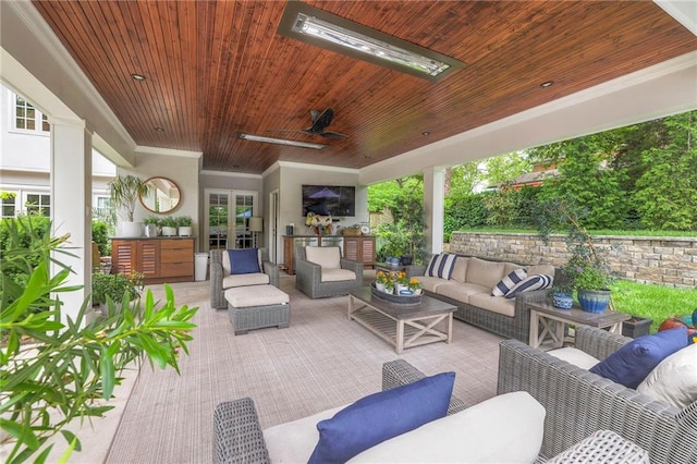 1055 W 54th St, Kansas City, MO 64112 - view of patio with outdoor lounge area, a ceiling fan, and french doors