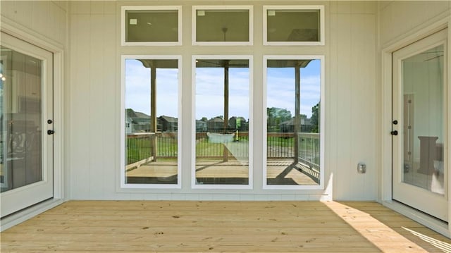 1300 Melissa Ct, Kearney, MO 64060 - unfurnished sunroom with a deck and wood finished floors