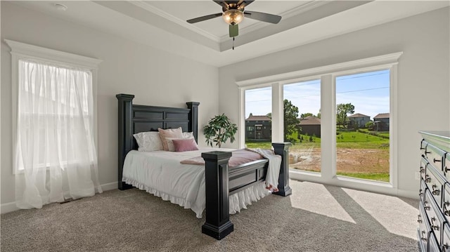 1300 Melissa Ct, Kearney, MO 64060 - carpeted bedroom featuring ornamental molding, a tray ceiling, baseboards, and a ceiling fan