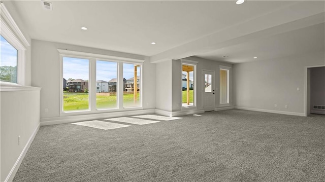 1300 Melissa Ct, Kearney, MO 64060 - unfurnished living room with carpet flooring, plenty of natural light, baseboards, and recessed lighting
