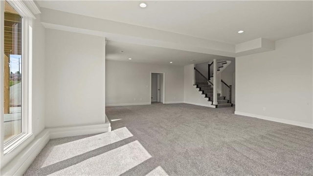1300 Melissa Ct, Kearney, MO 64060 - empty room featuring stairway, plenty of natural light, carpet, recessed lighting, and baseboards