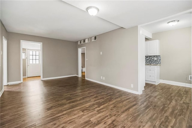 9318 Noland Rd, Lenexa, KS 66215 - empty room with dark wood finished floors and baseboards