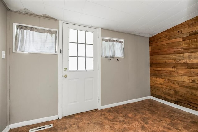 9318 Noland Rd, Lenexa, KS 66215 - doorway to outside with wood walls and vaulted ceiling
