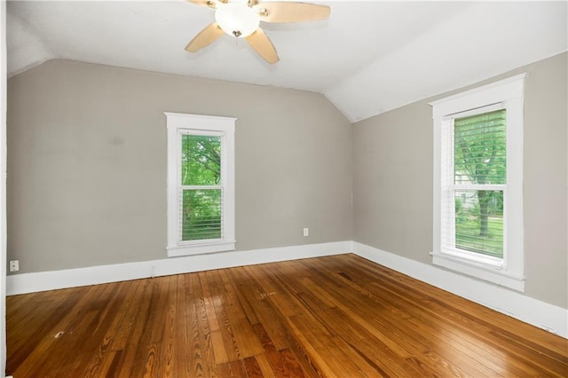 9318 Noland Rd, Lenexa, KS 66215 - additional living space with vaulted ceiling, wood-type flooring, ceiling fan, and baseboards