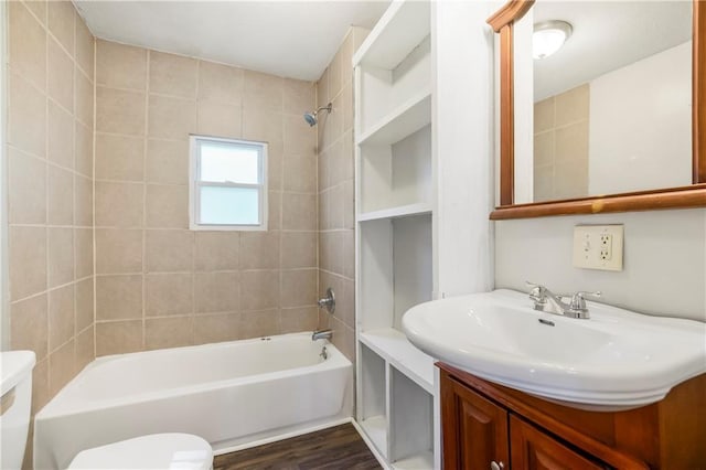 9318 Noland Rd, Lenexa, KS 66215 - bathroom featuring toilet, shower / washtub combination, vanity, and wood finished floors