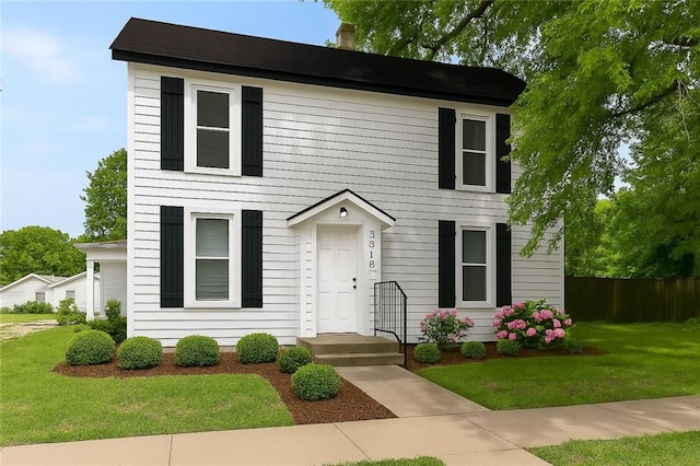 9318 Noland Rd, Lenexa, KS 66215 - colonial-style house featuring a chimney
