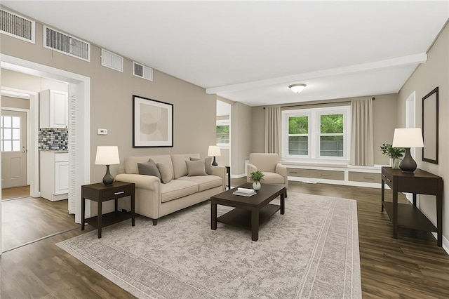 9318 Noland Rd, Lenexa, KS 66215 - living room with dark wood-style flooring and healthy amount of natural light