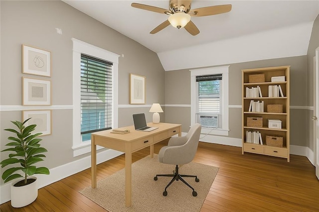 9318 Noland Rd, Lenexa, KS 66215 - home office with vaulted ceiling, cooling unit, wood finished floors, and a ceiling fan
