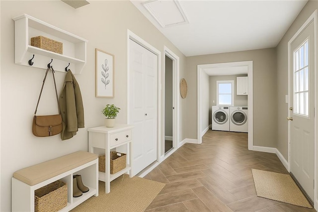 9318 Noland Rd, Lenexa, KS 66215 - mudroom featuring washing machine and clothes dryer and baseboards