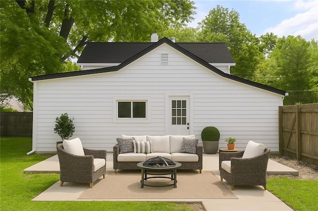 9318 Noland Rd, Lenexa, KS 66215 - fenced backyard with an outdoor living space with a fire pit and a patio area
