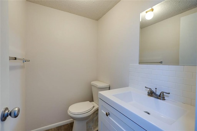 1506 N Holland Ct, Independence, MO 64056 - bathroom featuring tasteful backsplash, a textured ceiling, and vanity