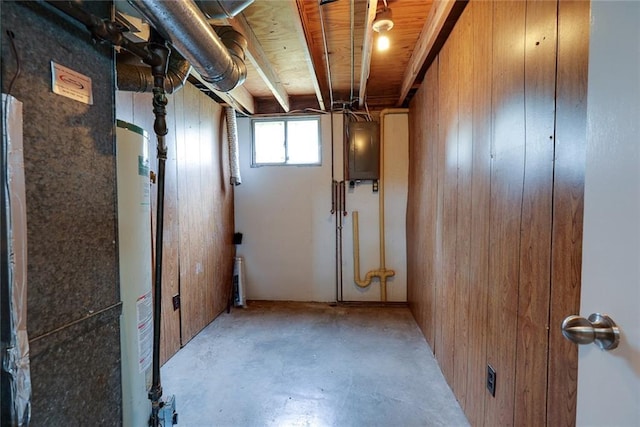 1506 N Holland Ct, Independence, MO 64056 - basement featuring wood walls, gas water heater, and electric panel