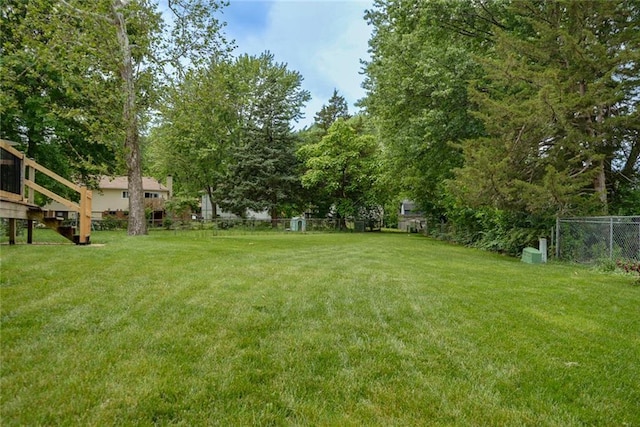 1506 N Holland Ct, Independence, MO 64056 - view of yard with view of wooded area