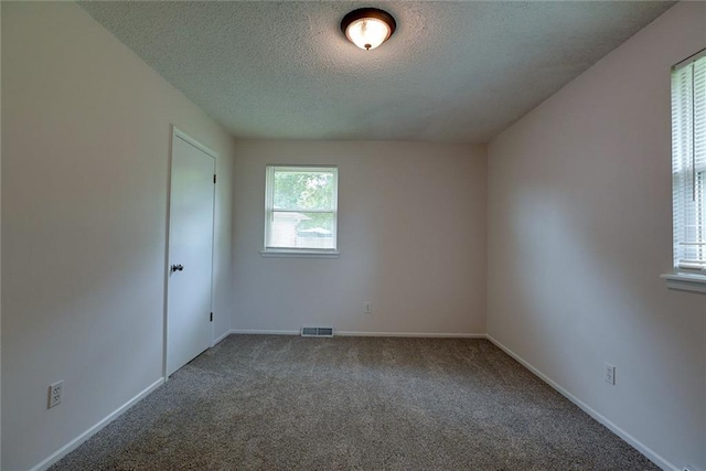 1506 N Holland Ct, Independence, MO 64056 - unfurnished room with a textured ceiling and carpet