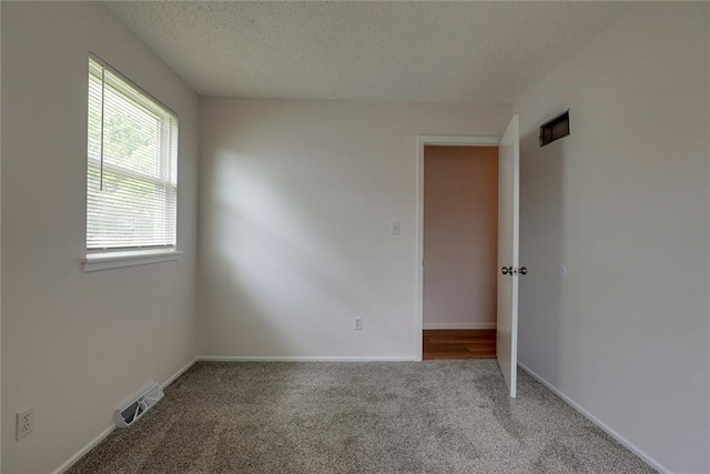 1506 N Holland Ct, Independence, MO 64056 - unfurnished room with carpet and a textured ceiling