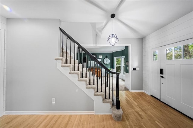 8102 W 153rd St, Overland Park, KS 66223 - foyer featuring wood finished floors, plenty of natural light, and stairway