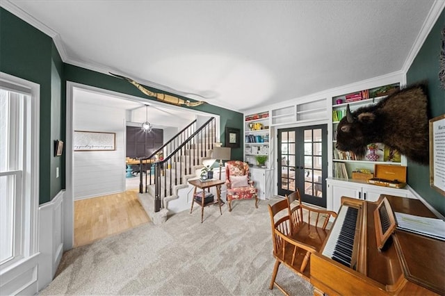 8102 W 153rd St, Overland Park, KS 66223 - sitting room with french doors, ornamental molding, stairs, carpet, and plenty of natural light