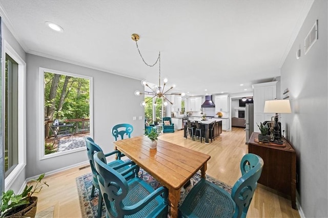 8102 W 153rd St, Overland Park, KS 66223 - dining space featuring crown molding, a chandelier, light wood-style floors, recessed lighting, and baseboards
