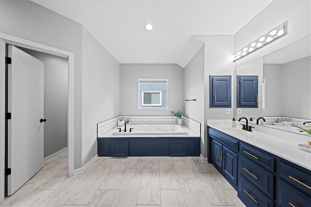 8102 W 153rd St, Overland Park, KS 66223 - bathroom with vanity, a garden tub, marble look tile flooring, and baseboards