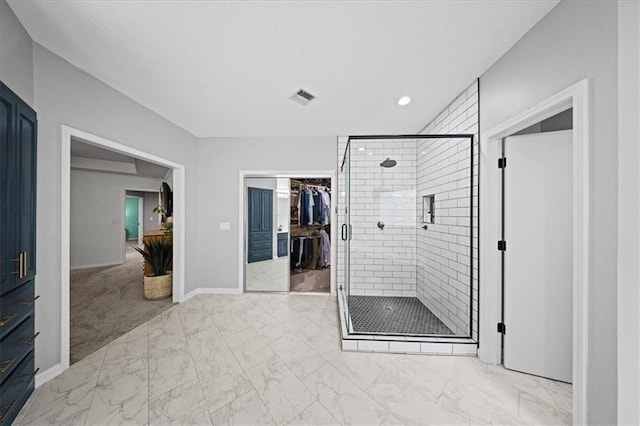 8102 W 153rd St, Overland Park, KS 66223 - bathroom featuring a stall shower, marble look tile flooring, a walk in closet, baseboards, and recessed lighting