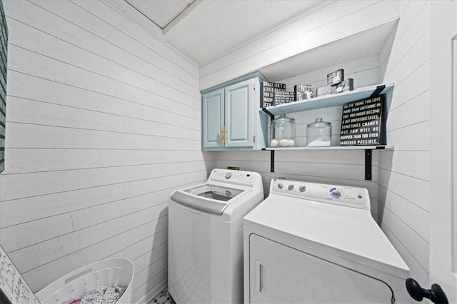 8102 W 153rd St, Overland Park, KS 66223 - washroom with cabinet space, washer and clothes dryer, and wooden walls