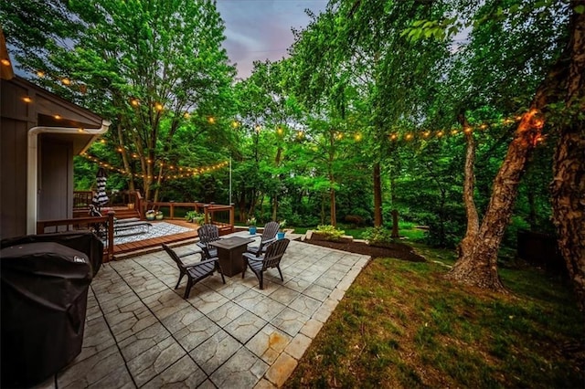 8102 W 153rd St, Overland Park, KS 66223 - patio terrace at dusk with a patio and area for grilling