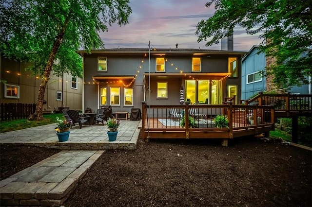 8102 W 153rd St, Overland Park, KS 66223 - back of property with a patio and a wooden deck