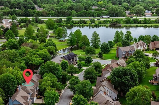 8102 W 153rd St, Overland Park, KS 66223 - aerial view of residential area with a nearby body of water and a tree filled landscape