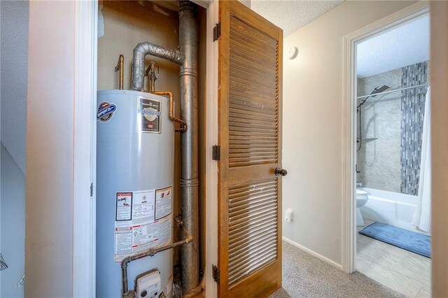 2406 Alabama St Unit 9D, Lawrence, KS 66046 - utility room featuring water heater