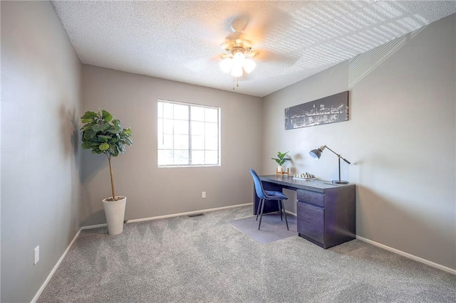 2406 Alabama St Unit 9D, Lawrence, KS 66046 - home office with ceiling fan, carpet, and a textured ceiling