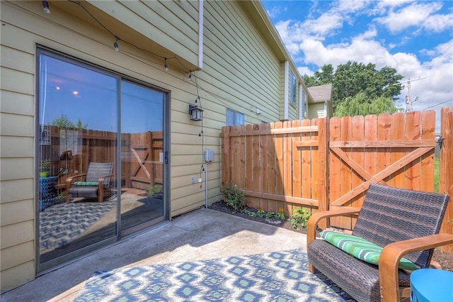 2406 Alabama St Unit 9D, Lawrence, KS 66046 - view of patio / terrace featuring a gate