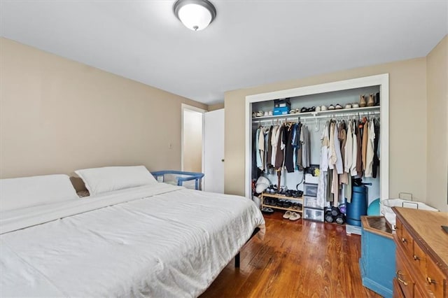 8700 Independence Ave, Kansas City, MO 64125 - bedroom with a closet and dark wood finished floors