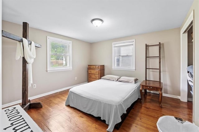 8700 Independence Ave, Kansas City, MO 64125 - bedroom with wood finished floors and baseboards