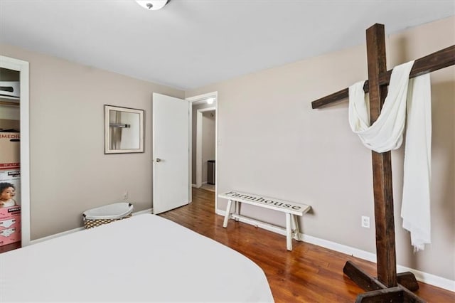 8700 Independence Ave, Kansas City, MO 64125 - bedroom with wood finished floors and baseboards