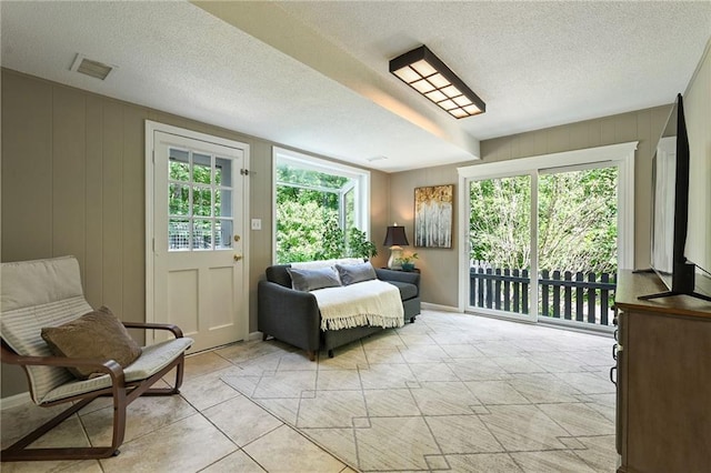 8 Apache Dr, Lake Winnebago, MO 64034 - bedroom with access to exterior, light tile patterned floors, and a textured ceiling