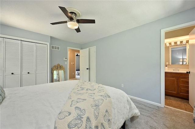 8 Apache Dr, Lake Winnebago, MO 64034 - carpeted bedroom featuring a closet, a sink, baseboards, ensuite bath, and a ceiling fan