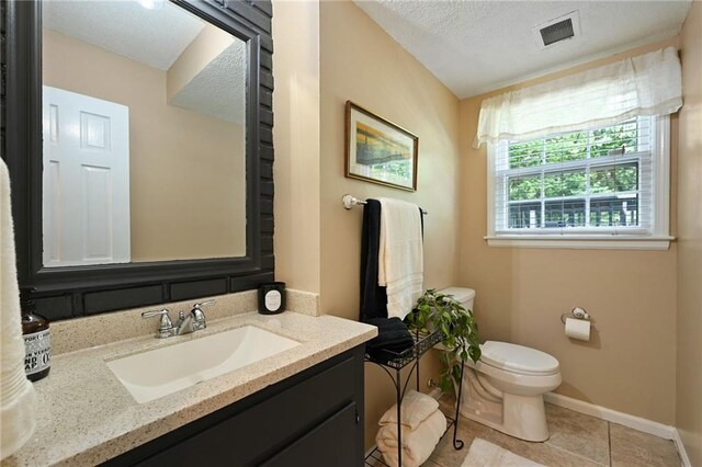 8 Apache Dr, Lake Winnebago, MO 64034 - bathroom featuring toilet, tile patterned floors, vanity, a textured ceiling, and baseboards